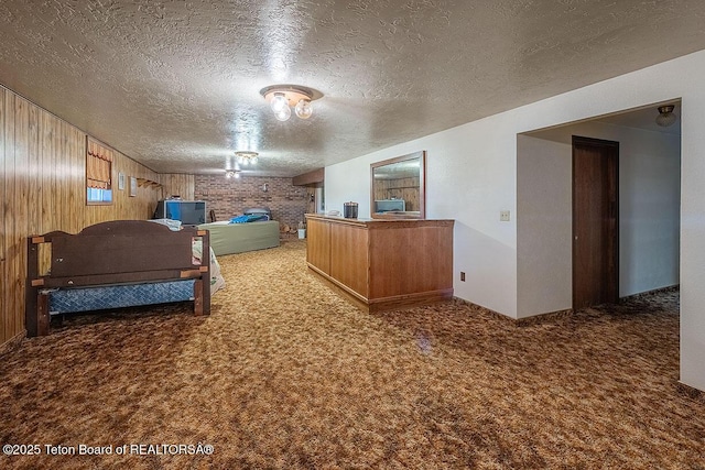 823 Allred Rd, Afton, WY 83110 - bedroom with carpet flooring, a textured ceiling, and wood walls