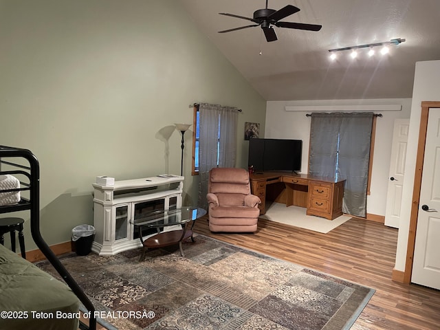 51 Cheyenne Cir, Star Valley Ranch, WY 83127 - bedroom with wood finished floors, lofted ceiling, baseboards, and rail lighting