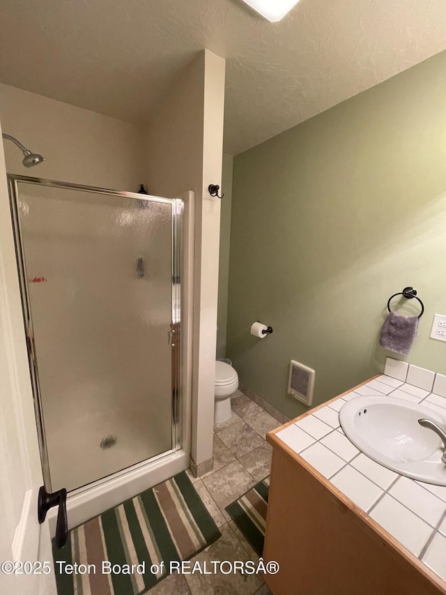 51 Cheyenne Cir, Star Valley Ranch, WY 83127 - full bath featuring a shower stall, toilet, and vanity