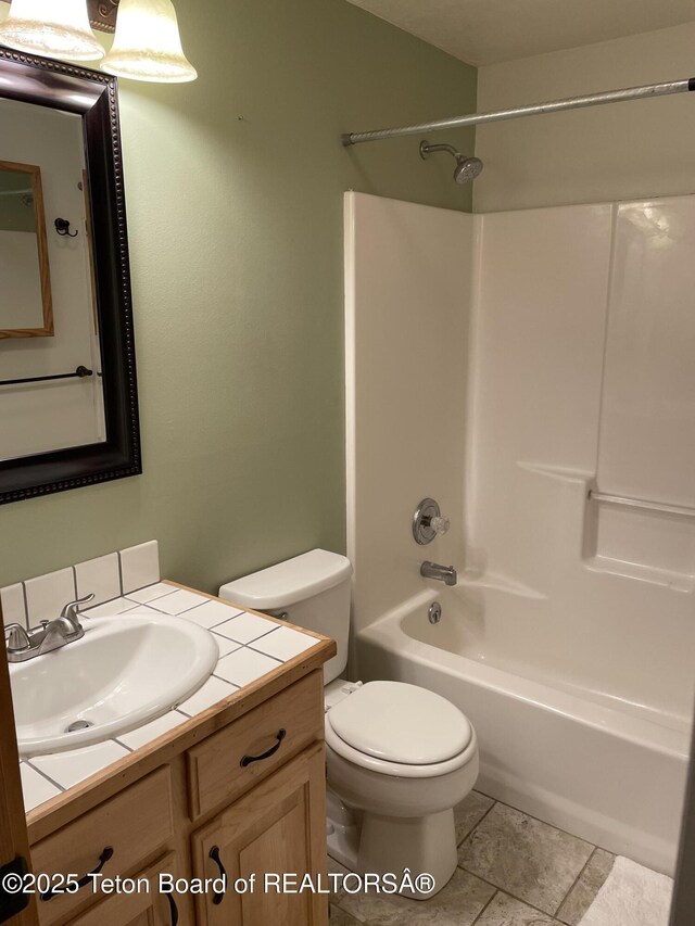 51 Cheyenne Cir, Star Valley Ranch, WY 83127 - bathroom featuring toilet, bathtub / shower combination, and vanity