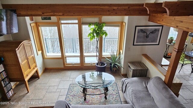 2435 Steelhead Dr, Tetonia, ID 83452 - living room featuring baseboards and stone tile floors