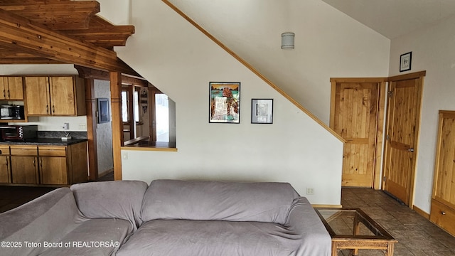 2435 Steelhead Dr, Tetonia, ID 83452 - living room featuring baseboards and dark stone finish flooring