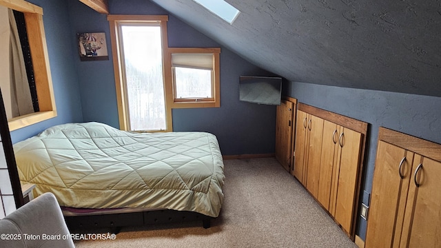 2435 Steelhead Dr, Tetonia, ID 83452 - bedroom featuring lofted ceiling, light colored carpet, and a skylight