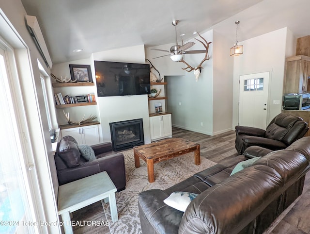 543 Rockbridge Dr, Afton, WY 83110 - living room featuring vaulted ceiling, wood finished floors, a ceiling fan, a glass covered fireplace, and baseboards