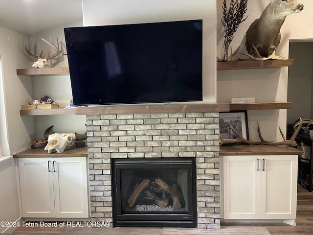 543 Rockbridge Dr, Afton, WY 83110 - detailed view of wood finished floors and a brick fireplace