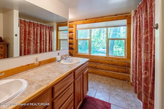 1238 Vista Dr, Star Valley Ranch, WY 83127 - full bathroom featuring log walls and double vanity