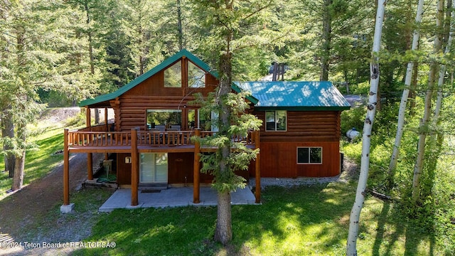 1238 Vista Dr, Star Valley Ranch, WY 83127 - rear view of property with log siding, a patio area, a lawn, and a deck