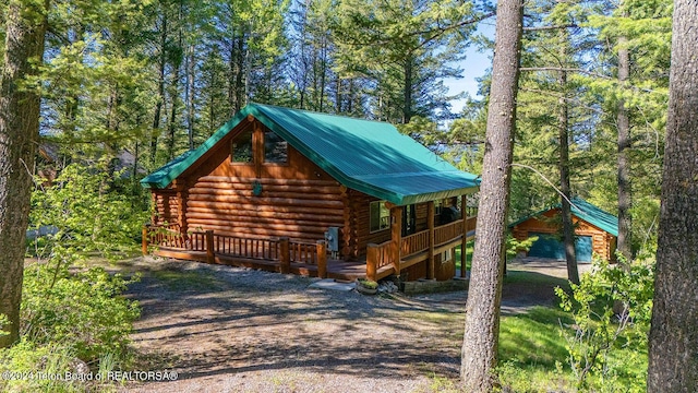 1238 Vista Dr, Star Valley Ranch, WY 83127 - view of property exterior with log exterior and metal roof