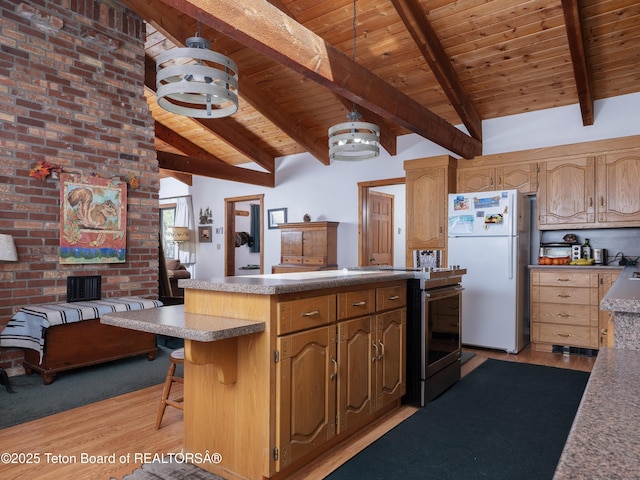 529 Quaking Aspen Dr, Driggs, ID 83422 - kitchen with freestanding refrigerator, wooden ceiling, light wood-style flooring, stainless steel electric stove, and a peninsula