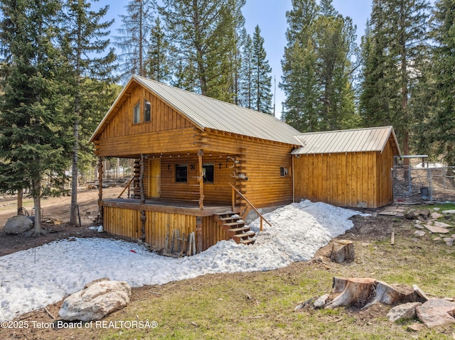 2 Porcupine Cir, Dubois, WY 82513 - log-style house with log exterior and a metal roof