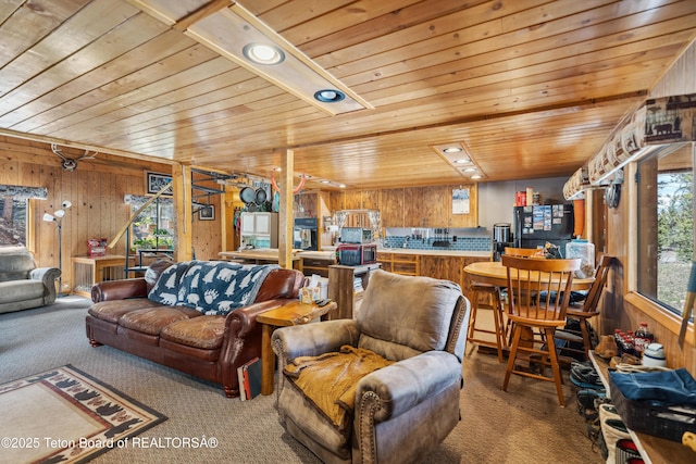 2 Porcupine Cir, Dubois, WY 82513 - living room featuring carpet flooring, wooden ceiling, wooden walls, and recessed lighting