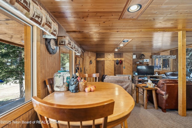 2 Porcupine Cir, Dubois, WY 82513 - carpeted dining area with wood walls and wooden ceiling