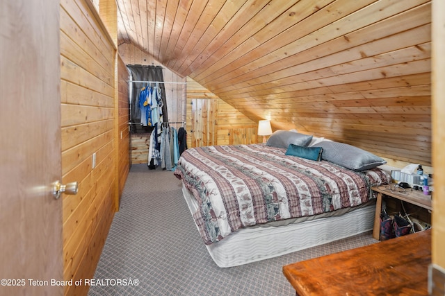 2 Porcupine Cir, Dubois, WY 82513 - bedroom with wood walls, lofted ceiling, carpet flooring, wood ceiling, and a closet