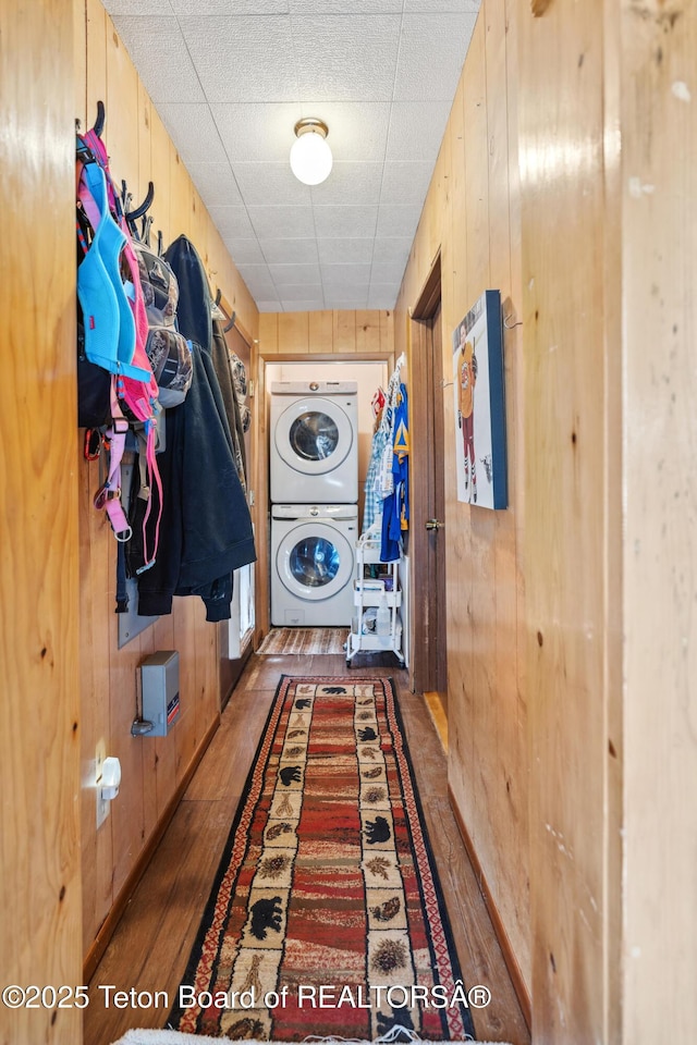 2 Porcupine Cir, Dubois, WY 82513 - laundry room with estacked washer and dryer, wood walls, and wood finished floors