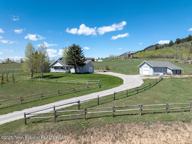 51 Buckaroo Cir, Etna, WY 83118 - view of yard with a rural view, driveway, and a detached garage