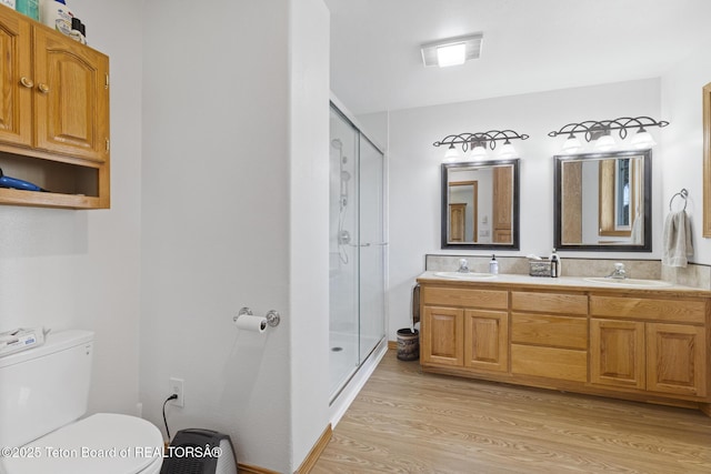 51 Buckaroo Cir, Etna, WY 83118 - bathroom with toilet, wood finished floors, a stall shower, and double vanity