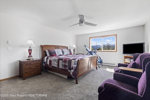 51 Buckaroo Cir, Etna, WY 83118 - bedroom with baseboard heating, carpet floors, a ceiling fan, and a textured ceiling