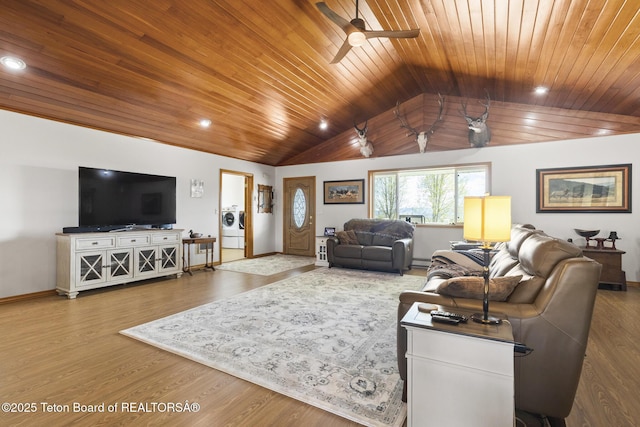 51 Buckaroo Cir, Etna, WY 83118 - living room featuring wood ceiling, vaulted ceiling, baseboards, washer / dryer, and a ceiling fan