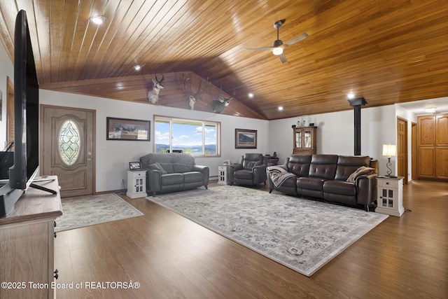 51 Buckaroo Cir, Etna, WY 83118 - living room featuring vaulted ceiling, wood ceiling, ceiling fan, a wood stove, and wood finished floors