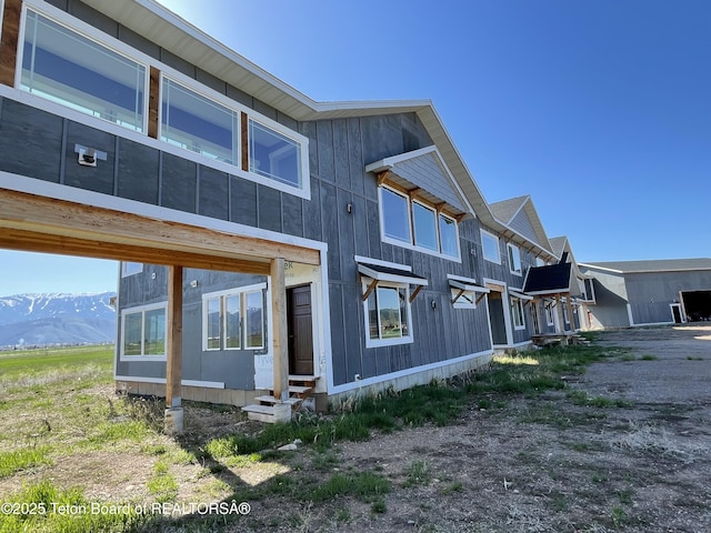 5860 Bitter Creek Rd, Afton, WY 83110 - rear view of property with entry steps and a mountain view