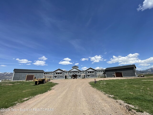 5860 Bitter Creek Rd, Afton, WY 83110 - view of front of house featuring dirt driveway and a front lawn