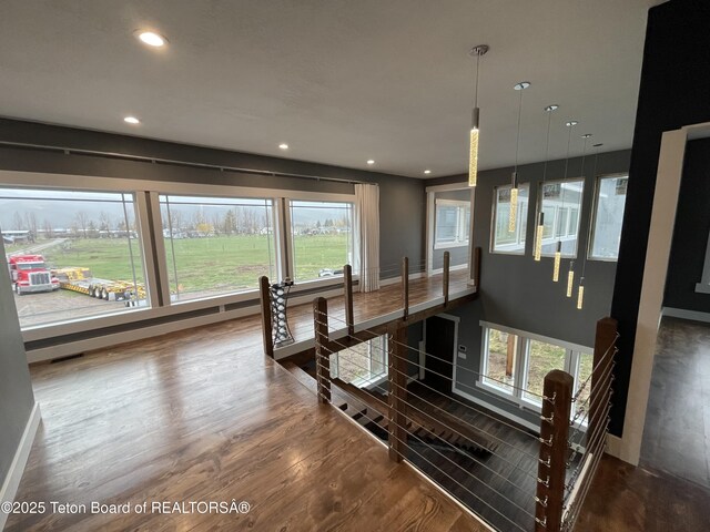 5860 Bitter Creek Rd, Afton, WY 83110 - stairway with wood finished floors, healthy amount of natural light, recessed lighting, and baseboards