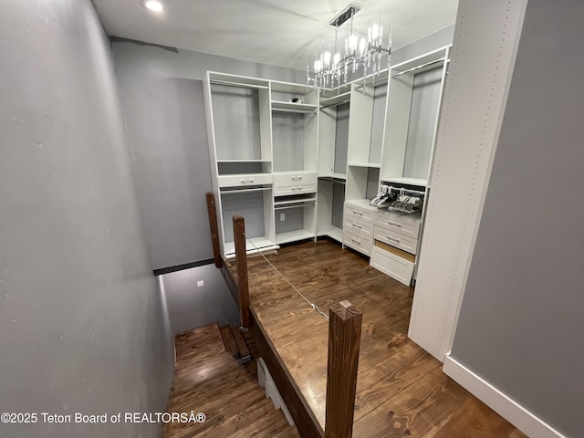 5860 Bitter Creek Rd, Afton, WY 83110 - spacious closet featuring dark wood-type flooring and a chandelier