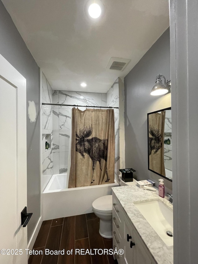 5860 Bitter Creek Rd, Afton, WY 83110 - bathroom with shower / bath combination with curtain, vanity, toilet, wood finish floors, and recessed lighting