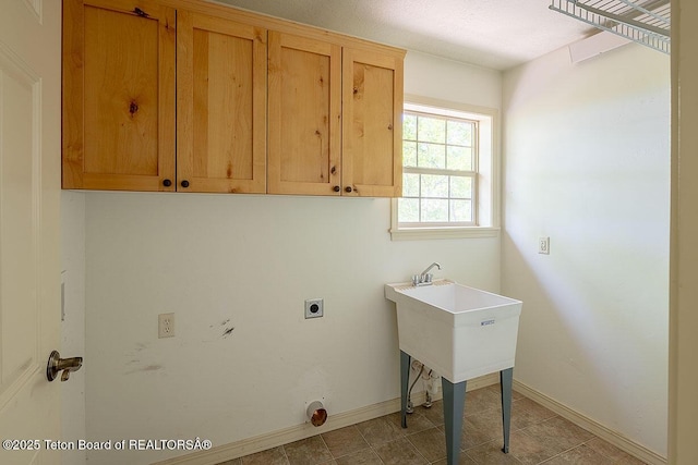 99 Sugar Lf, Star Valley Ranch, WY 83127 - laundry area with cabinet space, electric dryer hookup, and baseboards