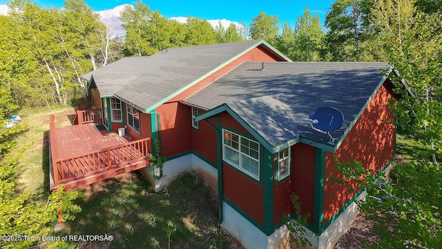 99 Sugar Lf, Star Valley Ranch, WY 83127 - view of property exterior with roof with shingles and a deck