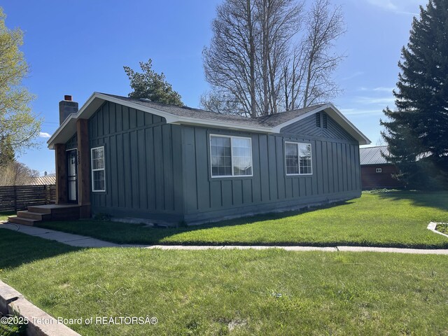 325 1st St N, Cokeville, WY 83114 - view of property exterior featuring board and batten siding and a chimney