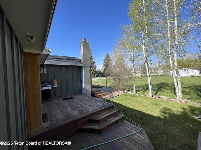 325 1st St N, Cokeville, WY 83114 - view of green lawn with a deck