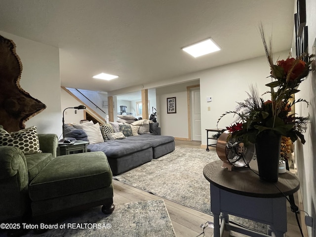 325 1st St N, Cokeville, WY 83114 - living area with light wood-style floors and stairway