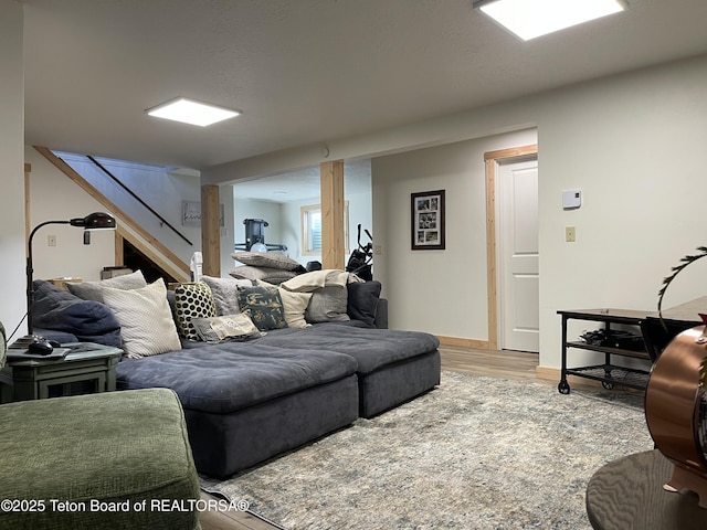 325 1st St N, Cokeville, WY 83114 - living area with stairway, wood finished floors, and baseboards