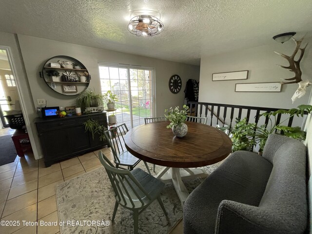 325 1st St N, Cokeville, WY 83114 - dining room featuring a textured ceiling and light tile patterned floors