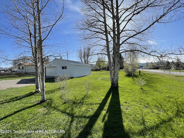 325 1st St N, Cokeville, WY 83114 - view of green lawn with an outbuilding and driveway