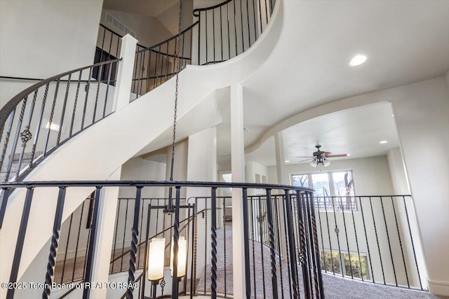 33 Willowbrook Dr, Driggs, ID 83422 - stairway featuring ceiling fan, recessed lighting, and a towering ceiling