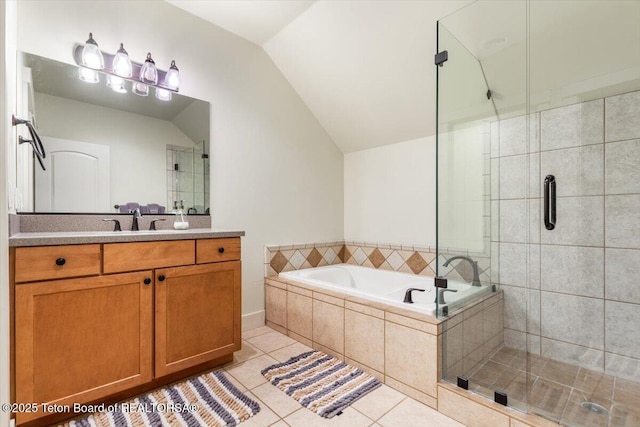 33 Willowbrook Dr, Driggs, ID 83422 - full bath featuring tile patterned floors, vaulted ceiling, a stall shower, a garden tub, and vanity