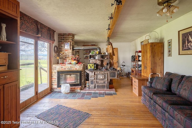 3837 County Road 126, Bedford, WY 83112 - living room featuring wood-type flooring, ceiling fan, and a textured ceiling