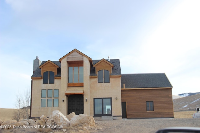60 Flying Frog St, Dubois, WY 82513 - view of front of house featuring a chimney and a shingled roof