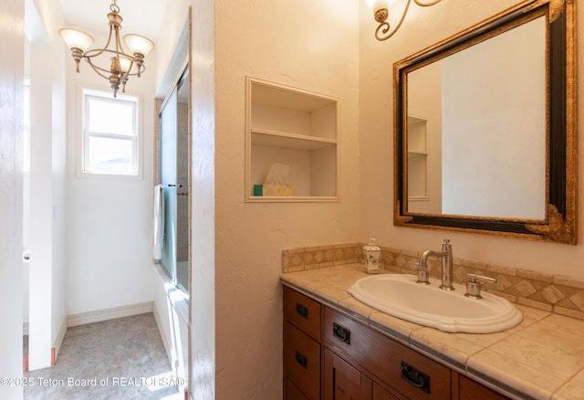 60 Flying Frog St, Dubois, WY 82513 - bathroom with vanity, a chandelier, and enclosed tub / shower combo