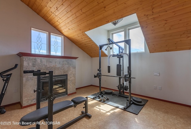 60 Flying Frog St, Dubois, WY 82513 - workout area featuring lofted ceiling, wood ceiling, baseboards, and a fireplace
