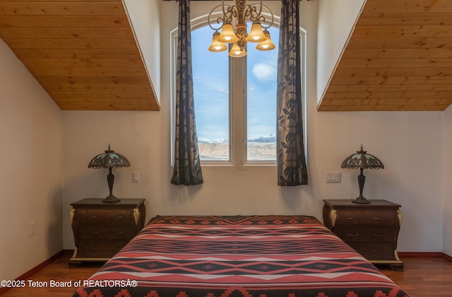 60 Flying Frog St, Dubois, WY 82513 - bedroom featuring wood finished floors, a chandelier, and baseboards