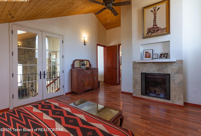 60 Flying Frog St, Dubois, WY 82513 - living area featuring wood ceiling, french doors, vaulted ceiling, wood finished floors, and a fireplace