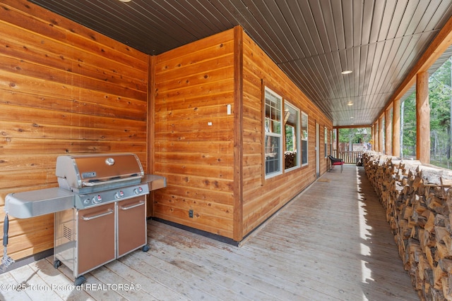 deck featuring area for grilling and covered porch