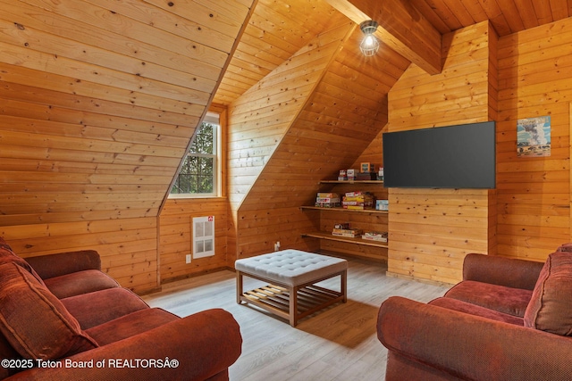 living room with wooden walls, wood ceiling, wood finished floors, and heating unit