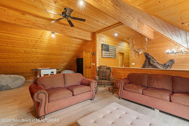 living room featuring wood ceiling, wooden walls, a ceiling fan, and wood finished floors