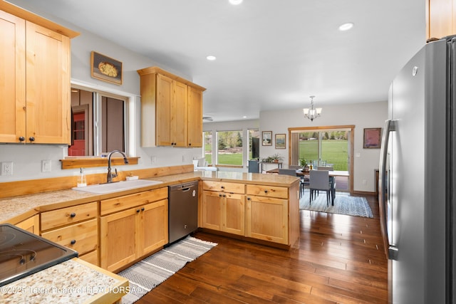 101 Alta Dr, Star Valley Ranch, WY 83127 - kitchen featuring stainless steel appliances, a sink, a peninsula, a chandelier, and light brown cabinetry
