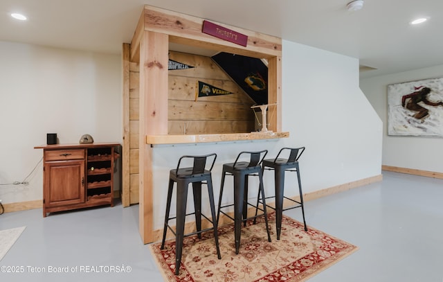 222 River Bench Rd, Alpine, WY 83128 - indoor dry bar with concrete flooring, recessed lighting, and baseboards