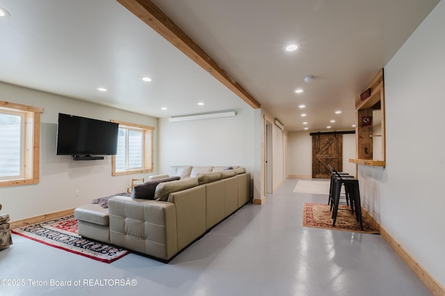 222 River Bench Rd, Alpine, WY 83128 - living area featuring finished concrete flooring, recessed lighting, and baseboards